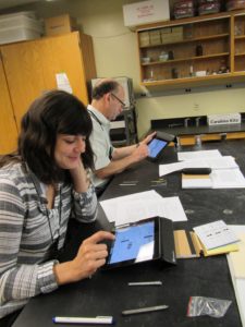 Rachel and Larry working on iPads during a mini workshop in Boston