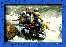 Photo of people on raft in whitewater