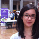 Photo of Cassandra near vendor tables at ABLE 2014 in Oregon