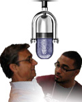 Photo of 2 attendees at ABLE 2009 with mic