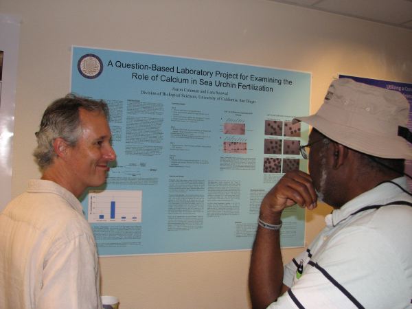 Aaron describes his poster to a passerby, ABLE 2011